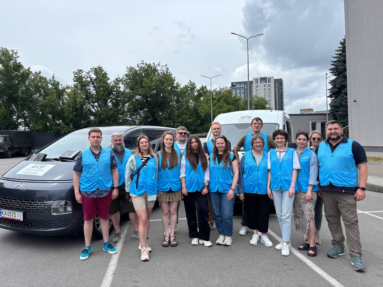 Global Care Force’s Ukraine-based staff and field team gathered beside GCF vehicles.
