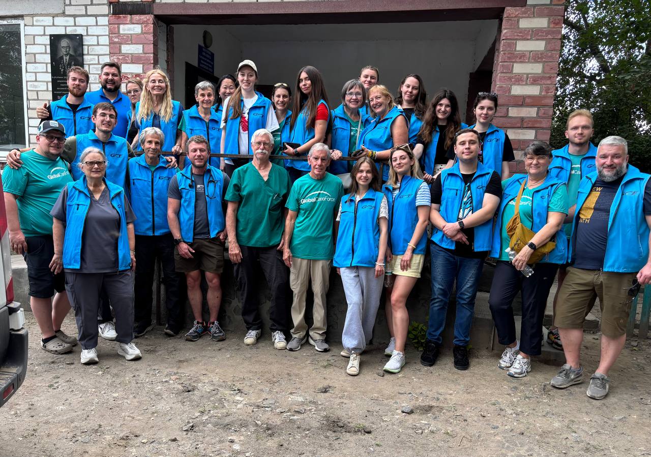 GCF volunteers and field team gathered outside a clinic.